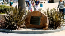 Photo of a dark black on a rock describing the Bay Street Beach historic site under its controversial nickname "The Inkwell"