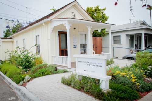 Image of the Shotgun House, a bungalow with yellow paint, built in 1897