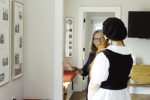 Patty conducting a tour at the Shotgun House for Doors Open California.