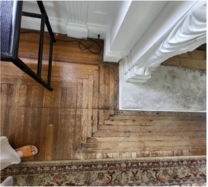 The floors of the Annenberg Community Beach House prior to rehabilitation