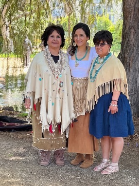 Elder tribal member Angie Behrns (left) alongside members of the Tongva tribe in traditional wear at Kuruvungna Springs.