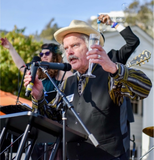 Volunteer Michael Burton giving a speech at Marion Davies Birthday celebration